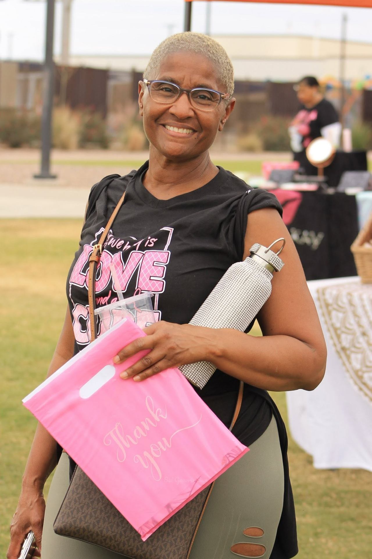 Survivor holding a thank-you bag