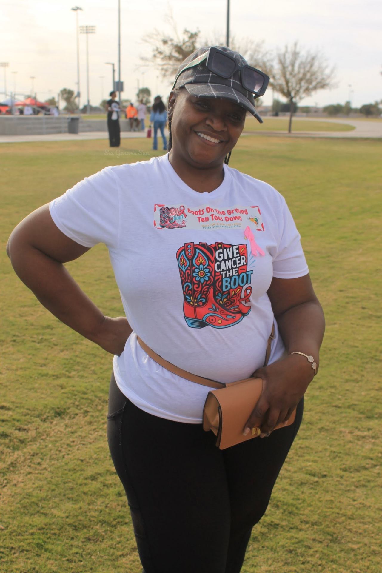 Walker repping the Give Cancer The Boot tee